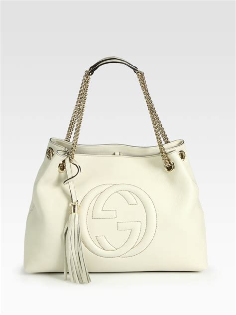 lighter sleeve gucci|white Gucci handbag.